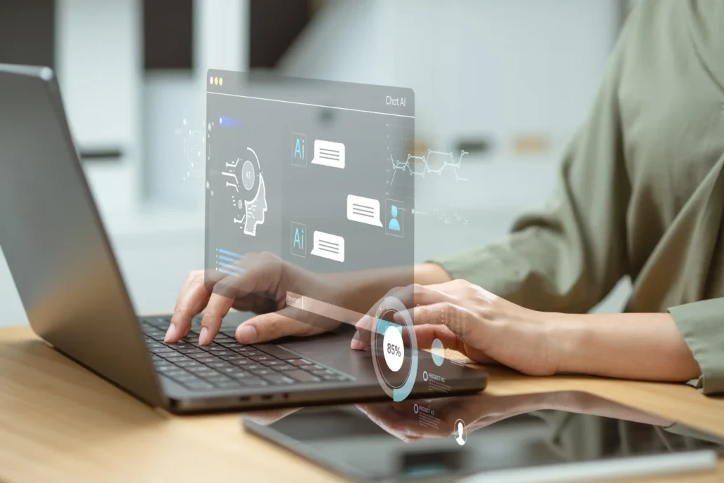 Project manager using AI project management dashboard on laptop with holographic interface for medical device development.