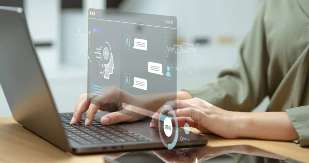 Project manager using AI project management dashboard on laptop with holographic interface for medical device development.