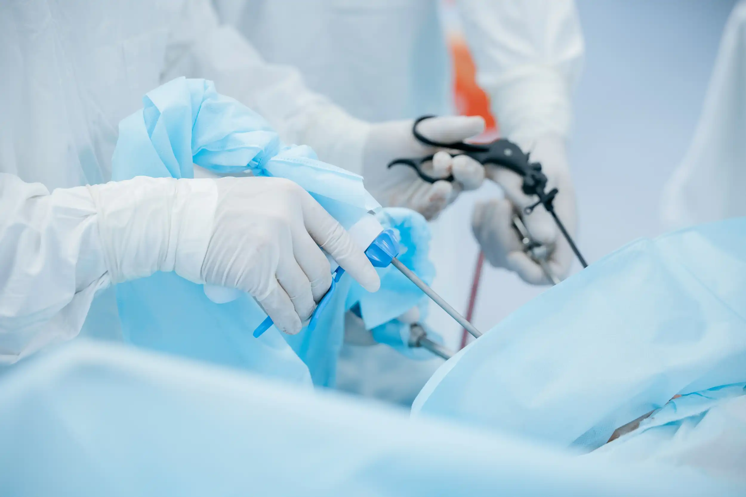 Surgeons using minimally invasive surgical instruments during a procedure in a sterile operating room environment