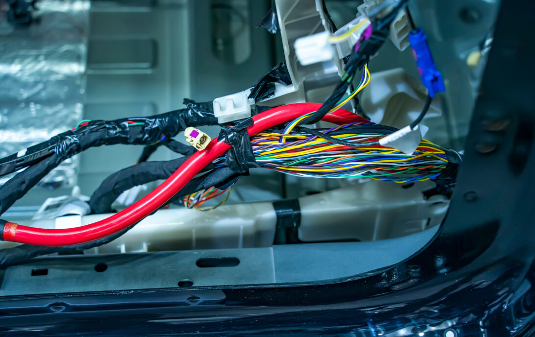 Large wide cable with wires and connectors and terminals in the wiring repair shop and electricians for connecting