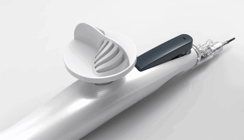 Close-up render of the IOL injector handpiece showing the loading mechanism, ergonomic grip and powered actuation components.