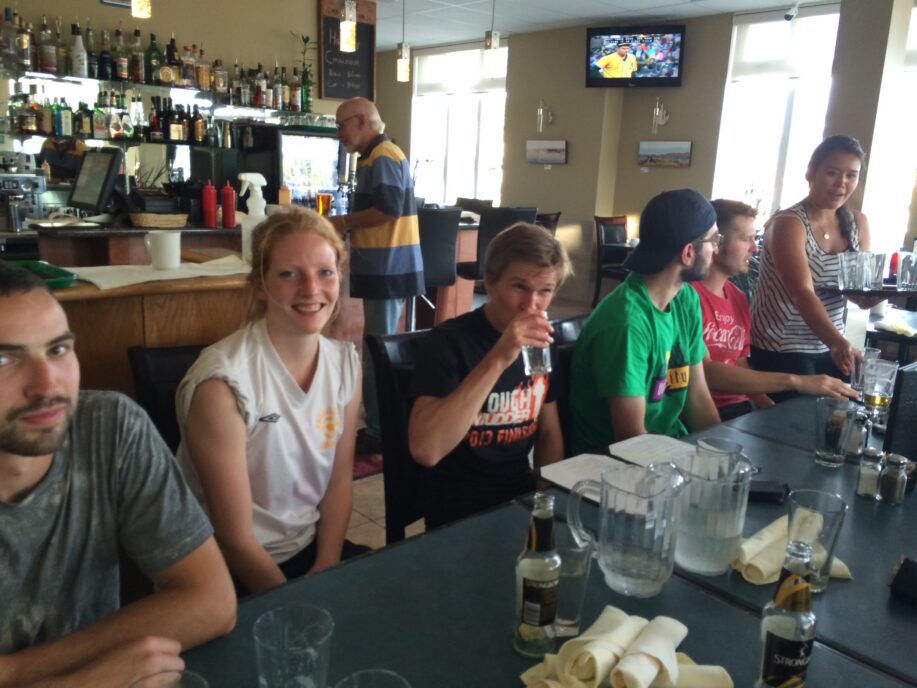 Accessibility: group of young adults sitting around a table at pub