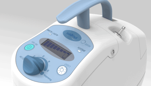 Close-up of the Inogen One Oxygen Concentrator control panel showing display screen, buttons and indicator lights.