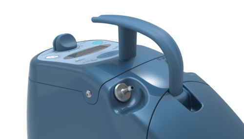 Inogen One Oxygen Concentrator with battery detached, showing the rear battery interface and venting.