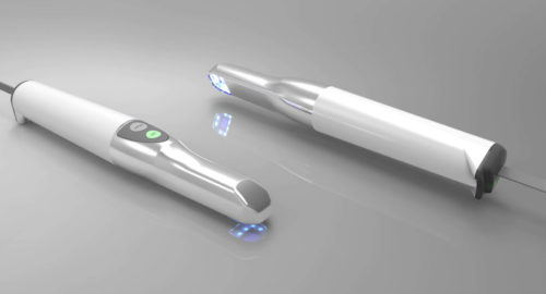 Rendered image of two intraoral scanners with LED illumination at the scanning tip, placed on a reflective surface to show device detail and ergonomics.