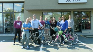 (L to R) Scott, Bjarne, Christian, John, Garrick, Kalonica, Mike, Lori, Jason, Jess, and Joe fill the empty parking spaces in front of StarFish and ViVitro on Day 1. 