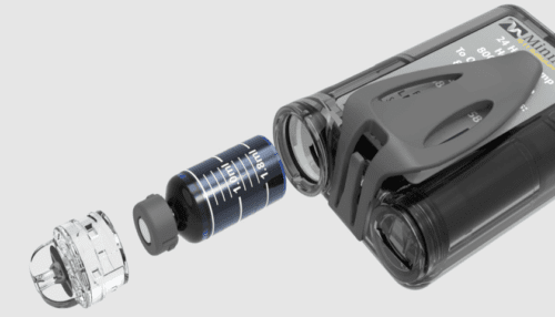 Exploded view of a MiniMed insulin pump showing internal components including motor assembly and enclosure parts.