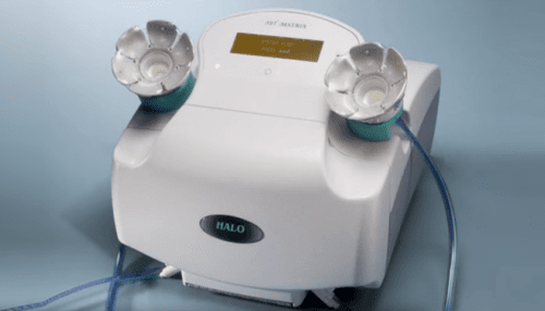 Front view of the HALO Breast Pap Test device with dual breast cups connected and digital display visible on the top panel.