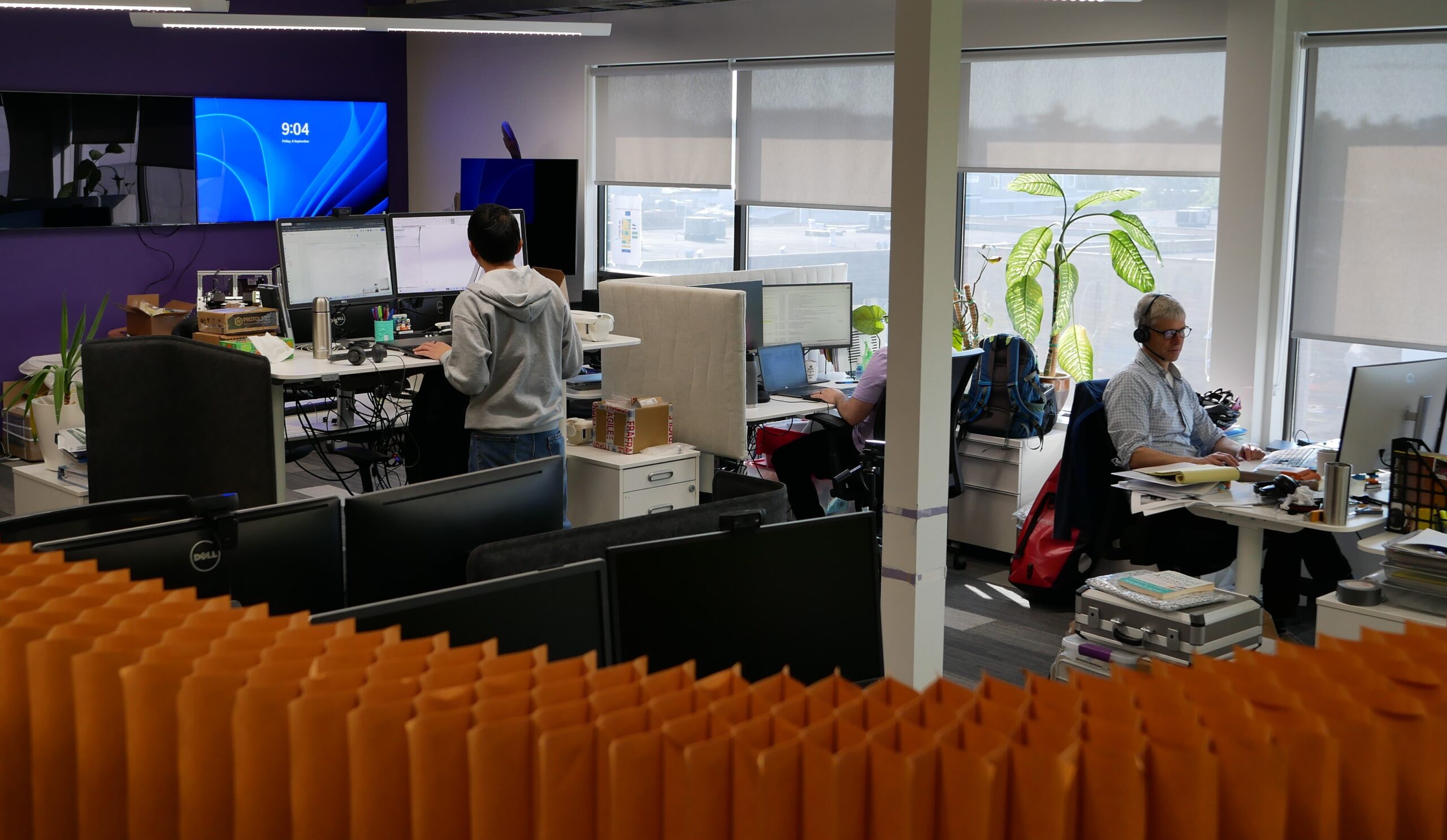 Employees working in office project pod as part of a Medical Device Innovation Initiative 