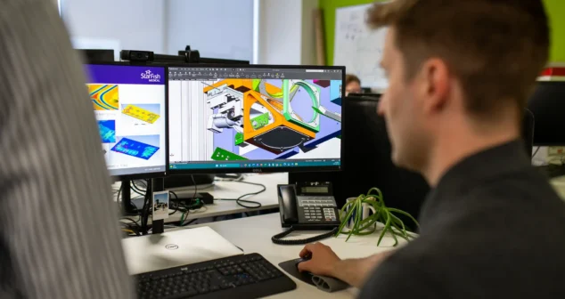StarFish Medical engineer reviewing FEA simulation and CAD model for medical device development