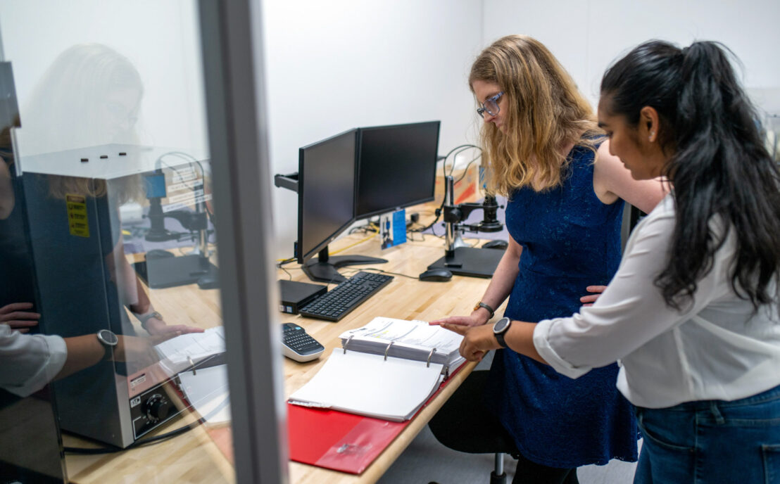 Two members of the QA and RA team in discussion