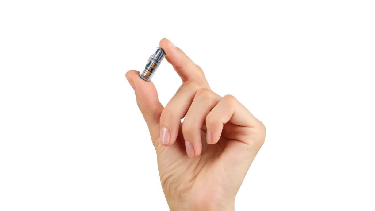 hand holding a unit of the progenity ingestible capsule