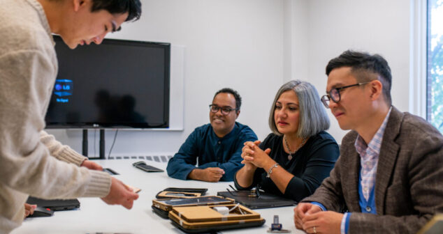 Group of professionals at StarFish Medical Toronto reviewing prototypes and discussing medical device design concepts.