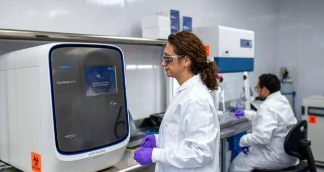 Scientists in ISO-certified laboratory using advanced equipment for medical device prototyping, verification testing, and pilot-scale manufacturing.