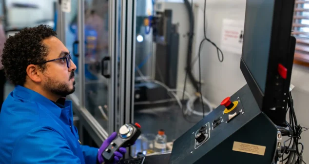 Engineer operating specialized lab equipment inside StarFish Medical Toronto office.