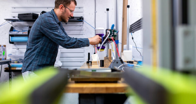 Tooling Engineer Accessibility: Engineer in tool shop checking tool fit.