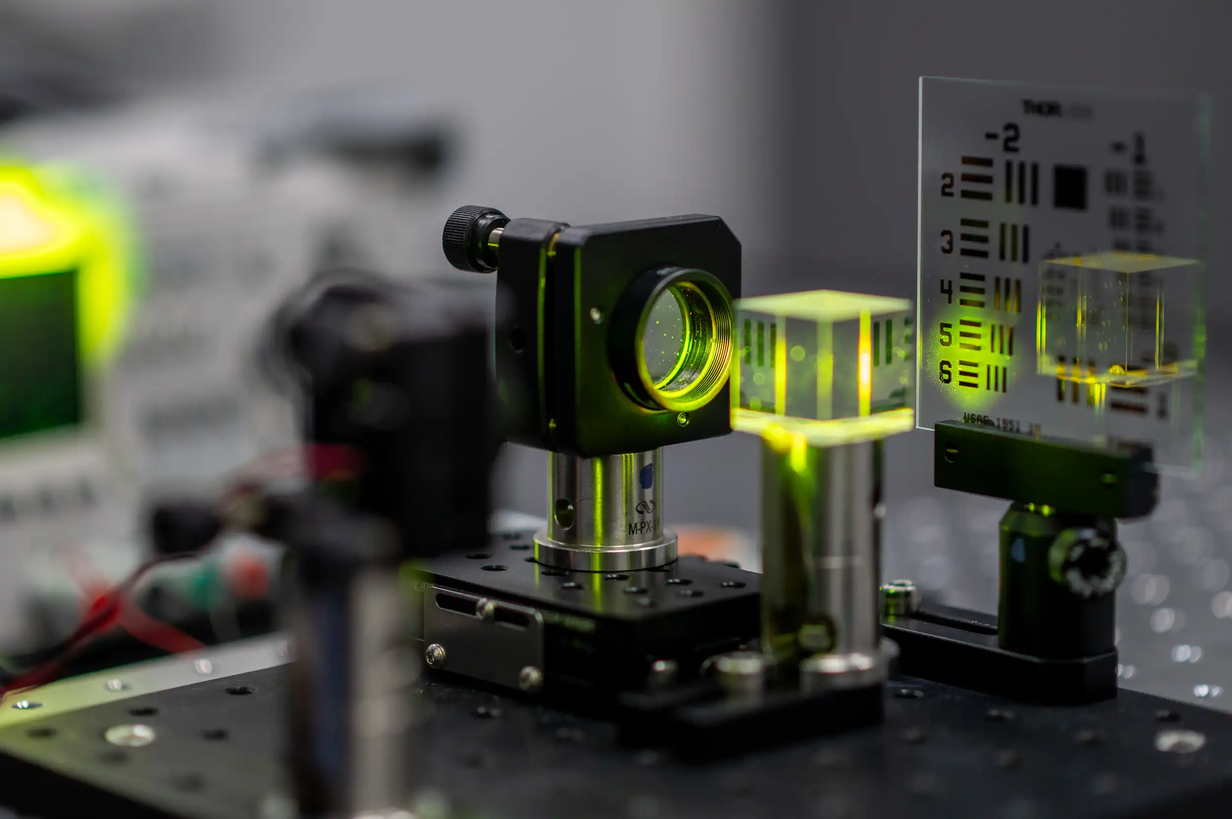 Precision optics and laser alignment equipment used in medical device development at Toronto facility.