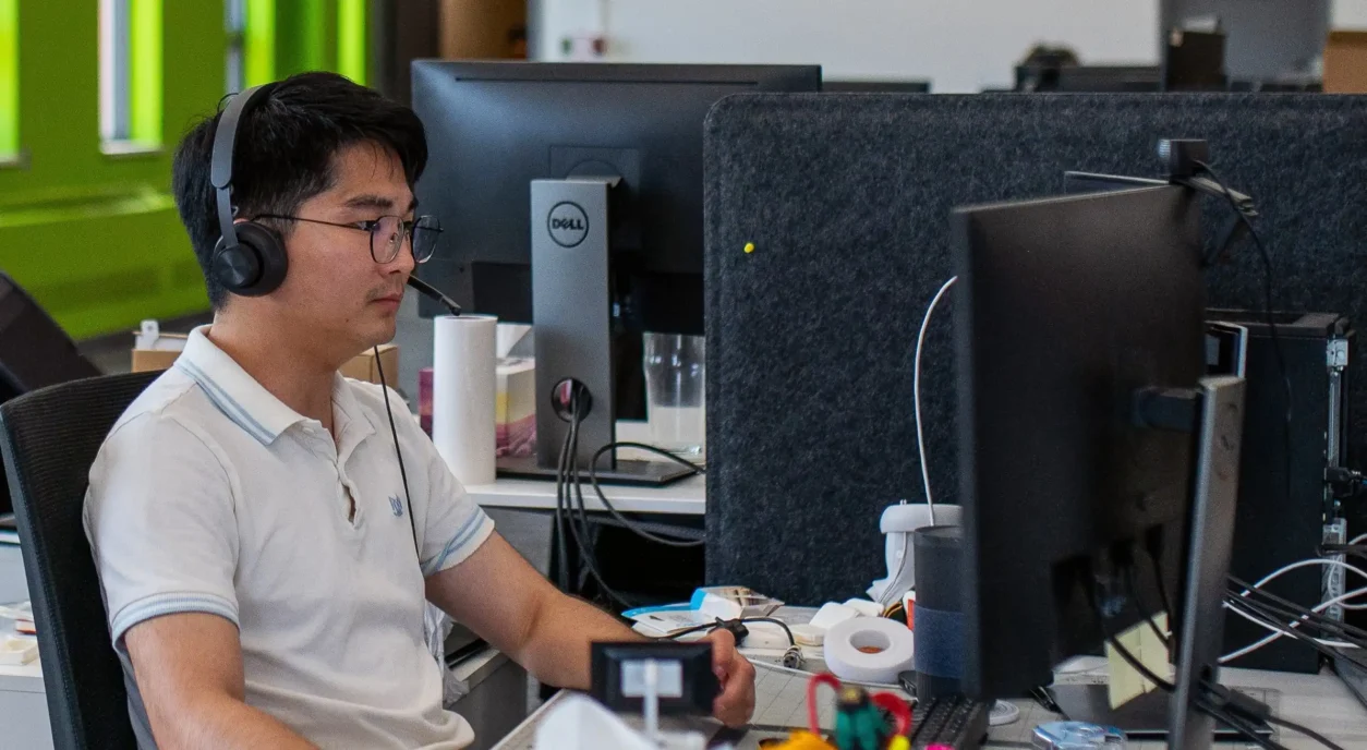 Senior Information Systems Developer working at desk in StarFish Medical office