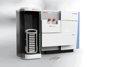 Rendered image of the cartridge carrier positioned beside the ThermoFisher VeriSpray ion source instrument for automated lab workflows.