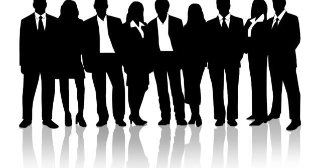 medical device development teamwork Accessibility: black and white graphic of 9 men and women standing in a line wearing business attire