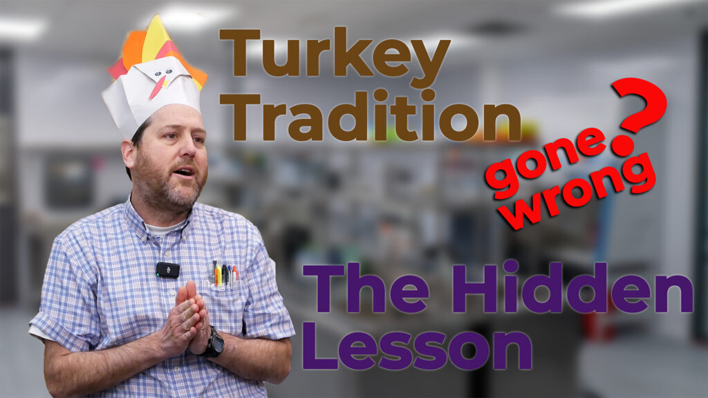 Nick Allan wearing a handmade turkey-themed hat speaks in a laboratory setting. The text overlay reads "Turkey Tradition Gone Wrong? The Hidden Lesson," highlighting a humorous and insightful discussion about traditions and their underlying purpose.