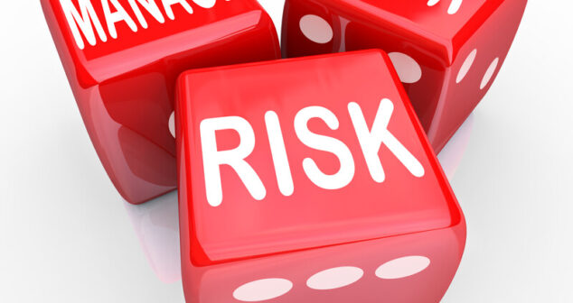 Medical Device Risk Management Thee dice with "Manage", "Your" and "Risk" on top facing side