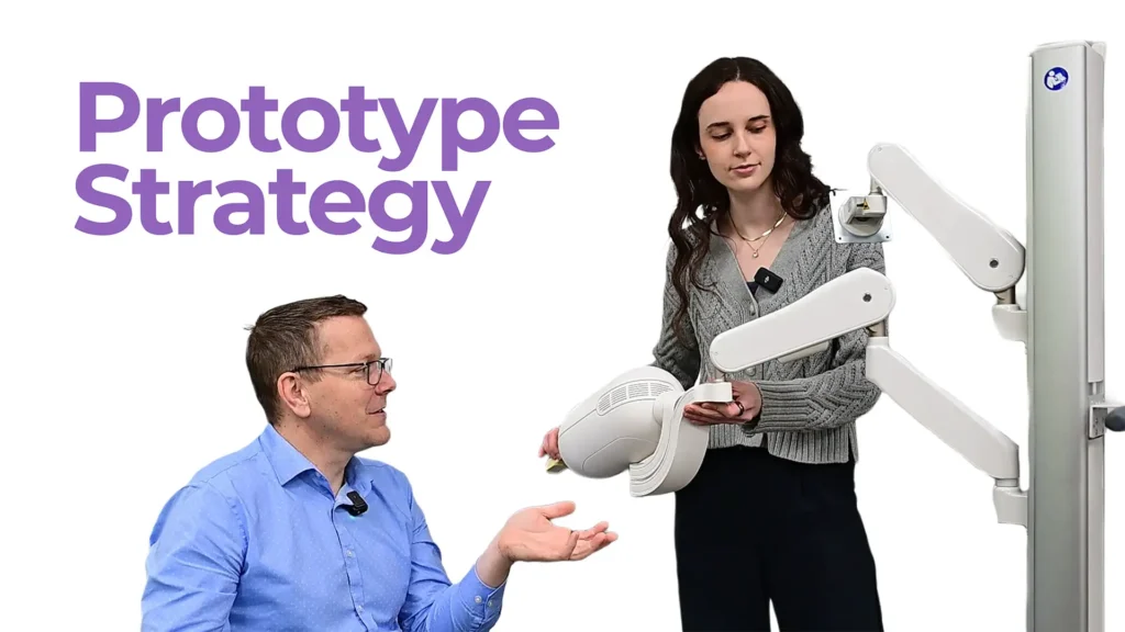 MedTech engineers discussing prototype strategy while demonstrating a medical device form prototype during product development.