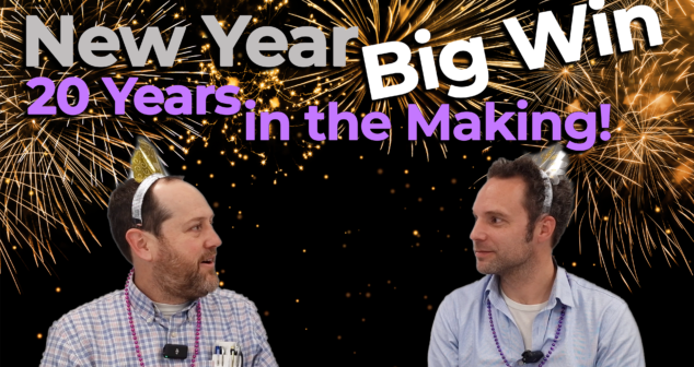 Two professionals wearing festive New Year’s accessories sit against a backdrop of fireworks. The text overlay reads "New Year Big Win: 20 Years in the Making!" emphasizing the celebration of a long-awaited achievement.