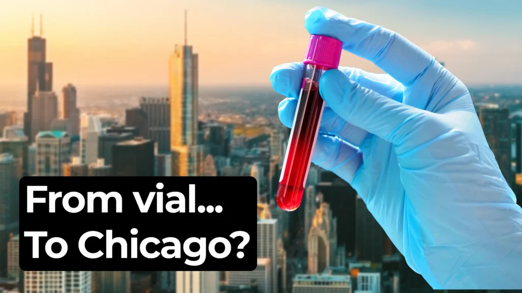 loved hand holding a blood vial in front of blurred Chicago skyline. Overlay text says ‘From vial… To Chicago?’ in bold white font on black background.