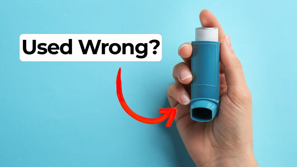 A hand holds a blue asthma inhaler against a light blue background. A red arrow points to the inhaler. Overlay text reads: ‘Used Wrong?’ in bold black letters on a white highlight.
