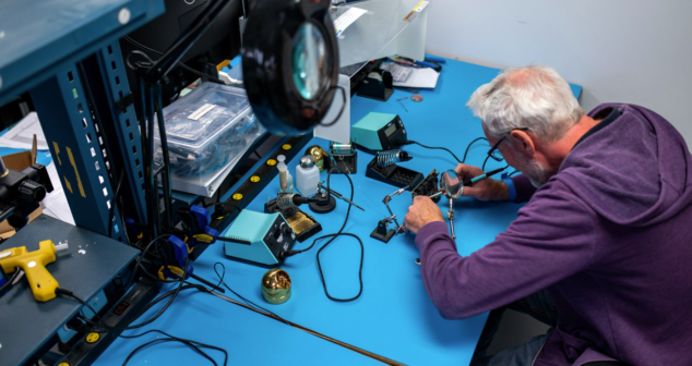 Technician working on medical device in shop