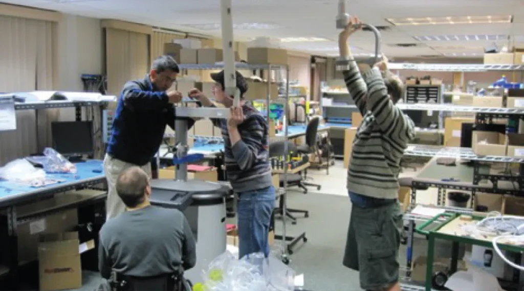 StarFish team assembling SPY Elite cart units during 2011 production